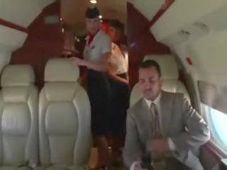 Randy stewardesses suck their clients hard shaft on the plane